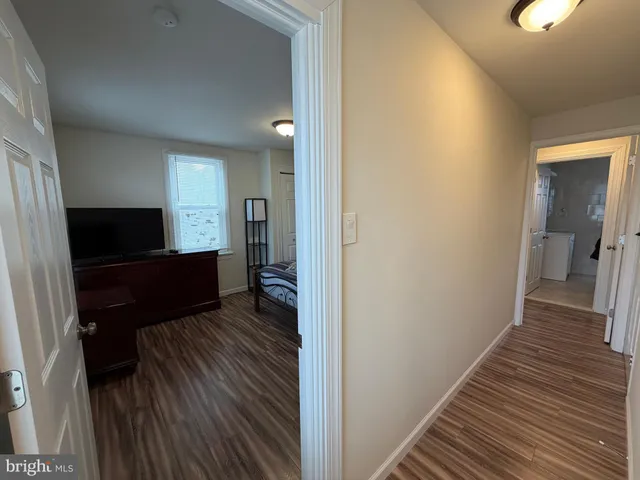 a view of a bedroom from a hallway