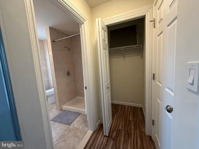 a bathroom with a sink and glass door