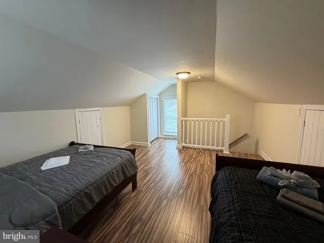 a bedroom with bed and window