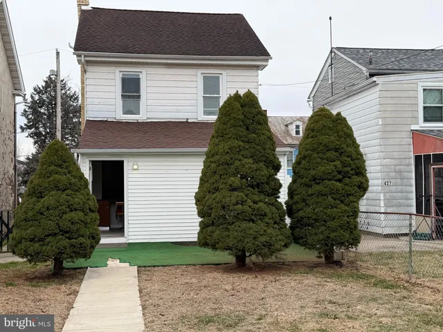 a view of a patio with chairs and a yard
