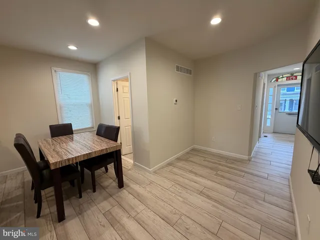 a workspace with furniture and wooden floor
