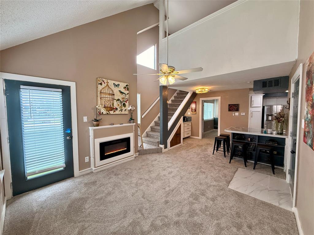9807 Walnut Street, Unit D205 Dallas, TX 75243 - Photo 5 of 20 a view of a livingroom with furniture and a fireplace