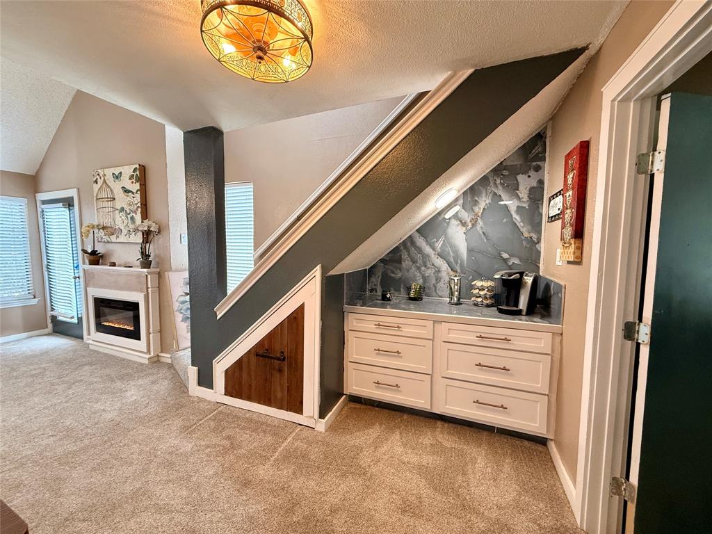 9807 Walnut Street, Unit D205 Dallas, TX 75243 - Photo 7 of 20 a view of an entryway with fireplace