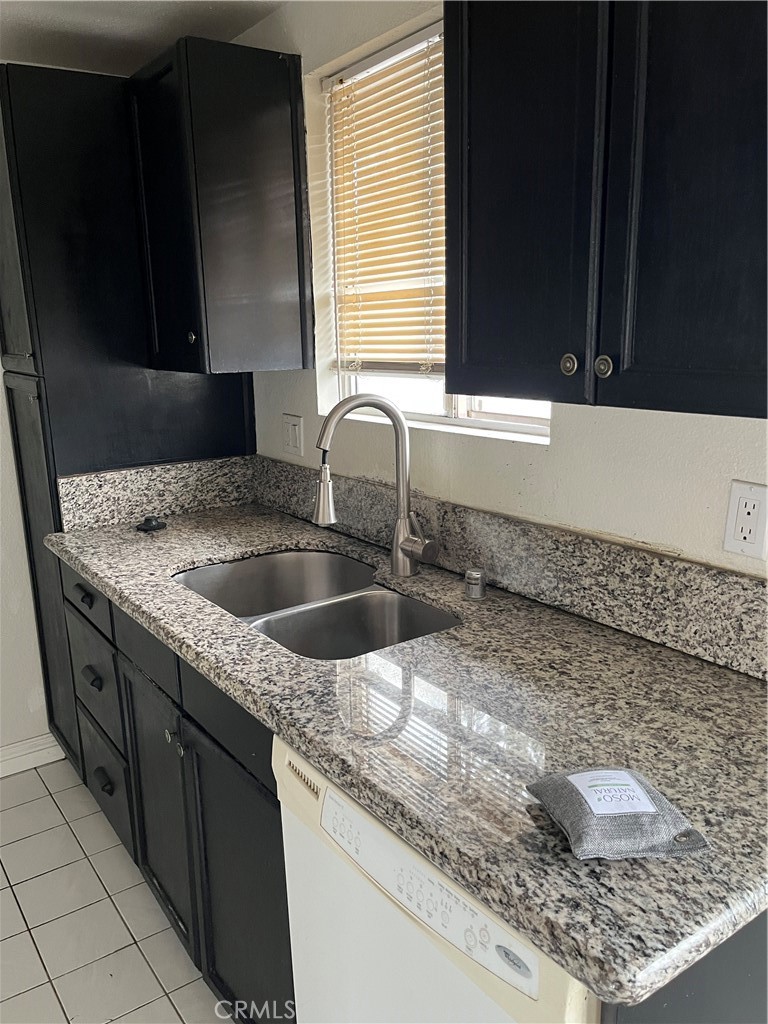 3073 Gladstone Street, Unit 4 Pomona, CA 91767 - Photo 8 of 10 a kitchen with a sink and a window
