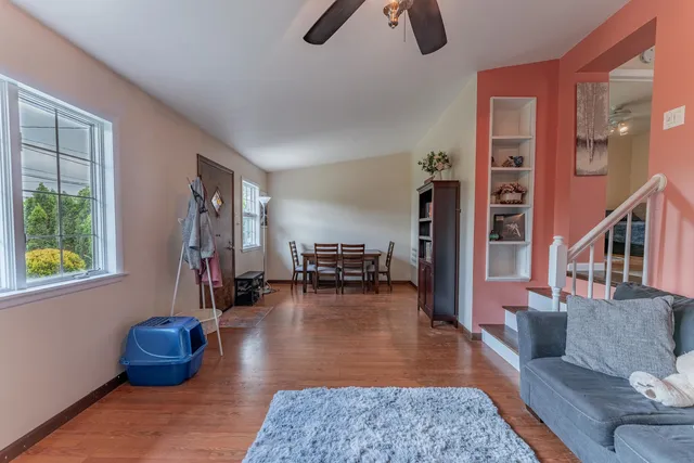 a living room with furniture rug and a table