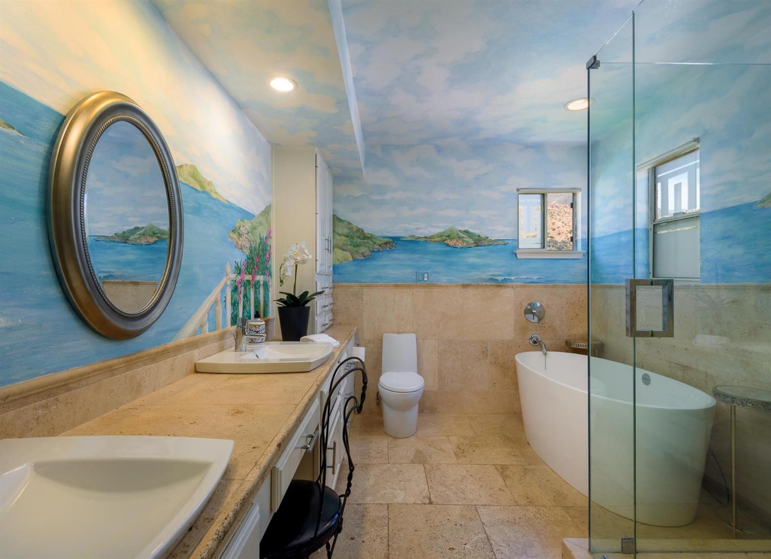 1201 Rains Court Ojai, CA 93023 - Photo 26 of 38 a bathroom with a sink a mirror and a toilet