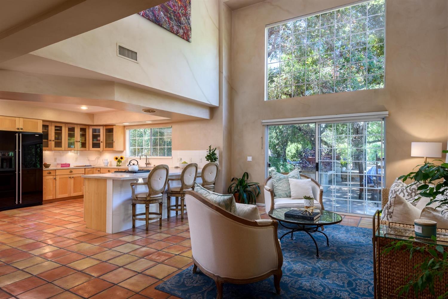 1201 Rains Court Ojai, CA 93023 - Photo 10 of 38 a living room with couches a dining table and a dining table with garden view