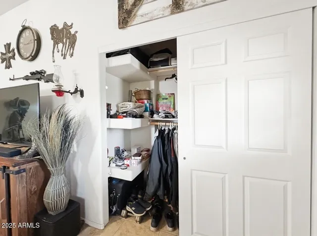 a kitchen with stainless steel appliances granite countertop a refrigerator a sink a stove and oven