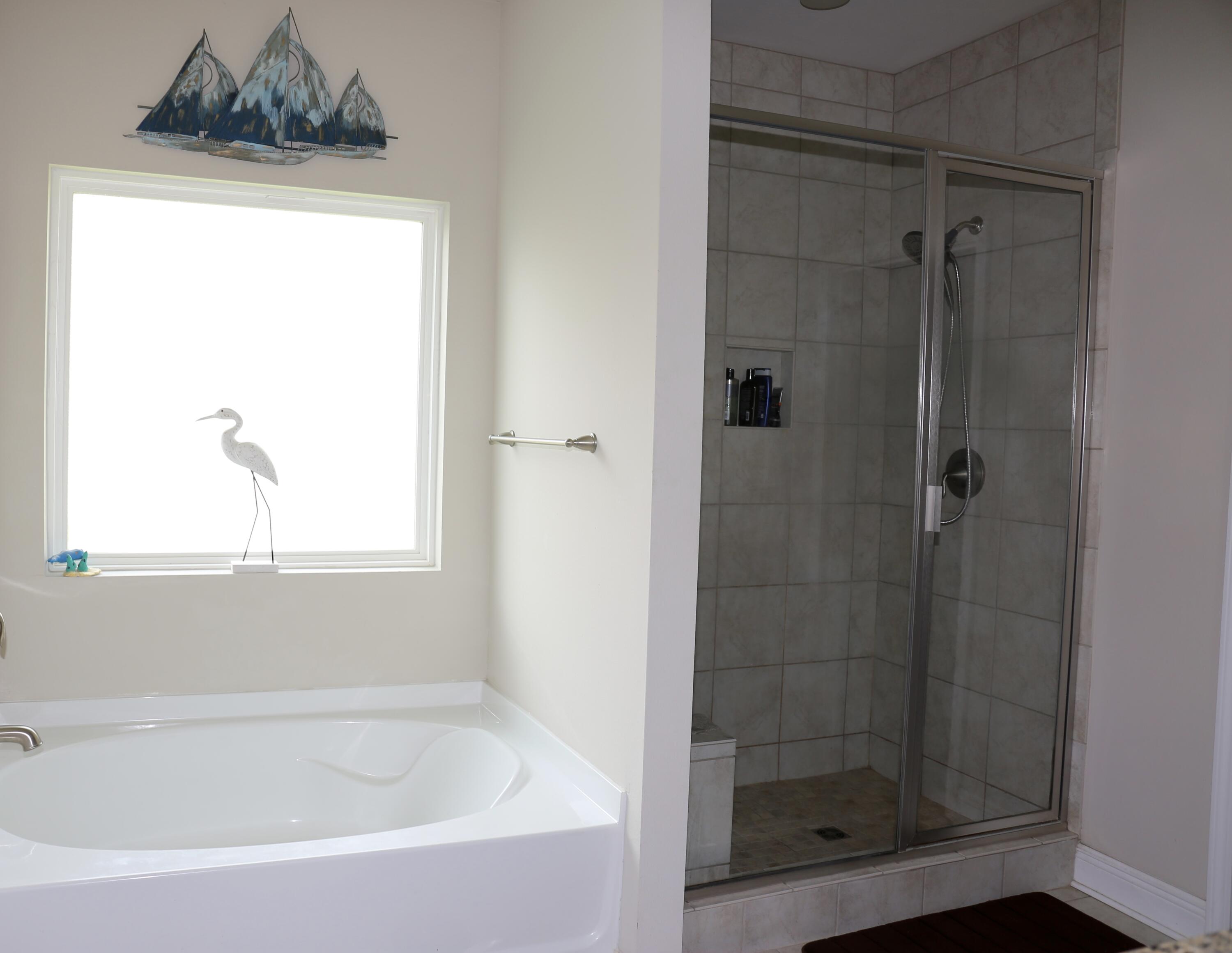 400 Lilly Bell Lane, Unit LOT 26 Freeport, FL 32439 - Photo 20 of 43 a white bath tub sitting next to a shower
