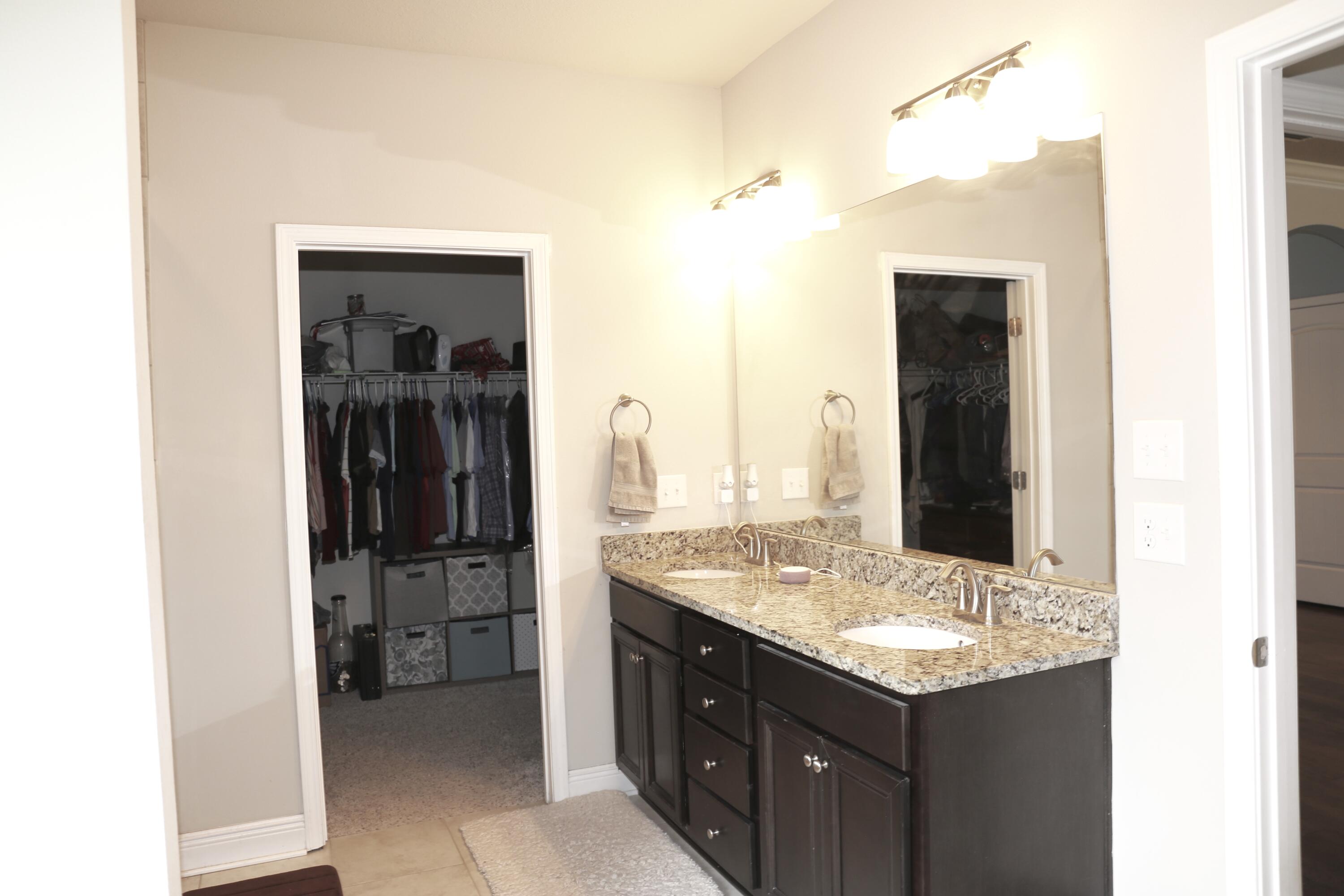 400 Lilly Bell Lane, Unit LOT 26 Freeport, FL 32439 - Photo 21 of 43 a bathroom with a sink and a mirror