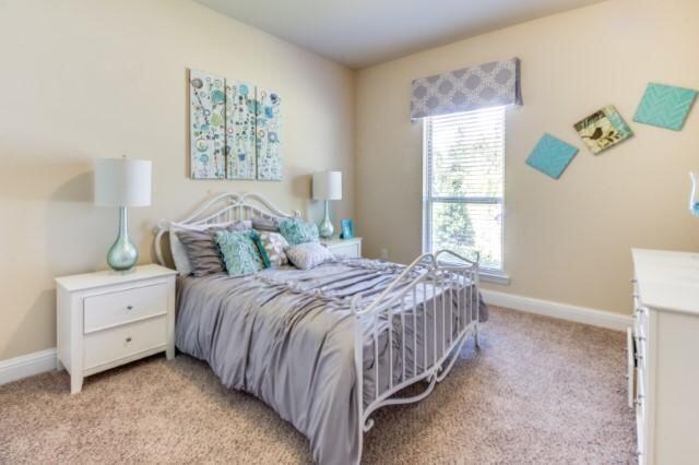 400 Lilly Bell Lane, Unit LOT 26 Freeport, FL 32439 - Photo 22 of 43 a bedroom with a bed and a window