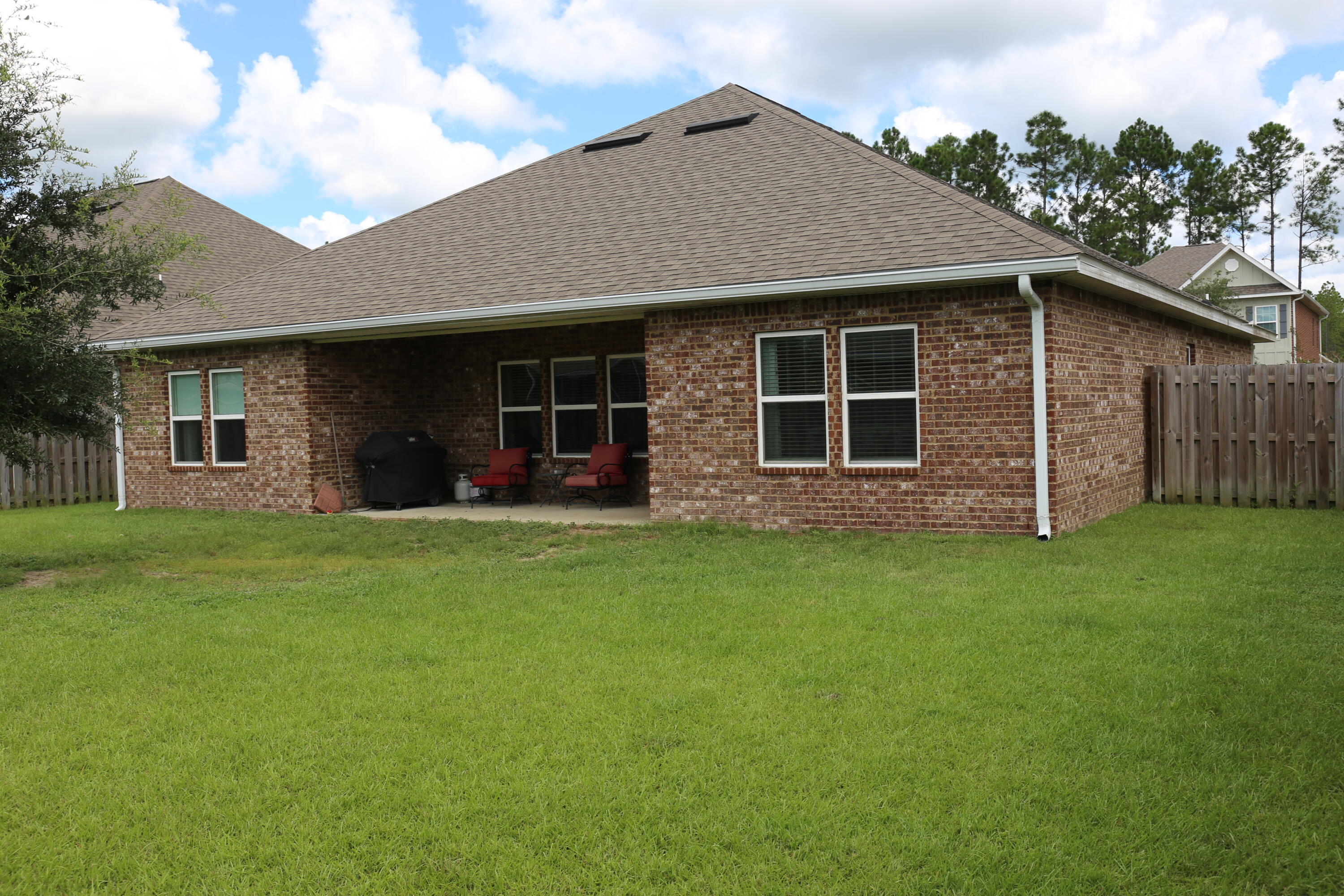 400 Lilly Bell Lane, Unit LOT 26 Freeport, FL 32439 - Photo 37 of 43 a front view of house with yard and green space