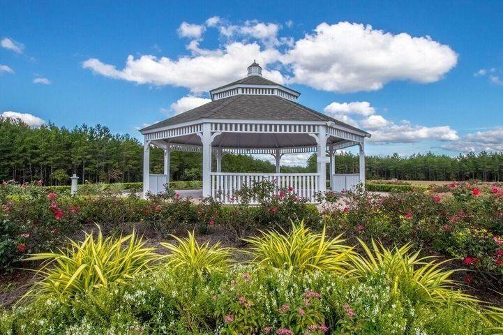 400 Lilly Bell Lane, Unit LOT 26 Freeport, FL 32439 - Photo 42 of 43 a view of a house with a big yard and potted plants