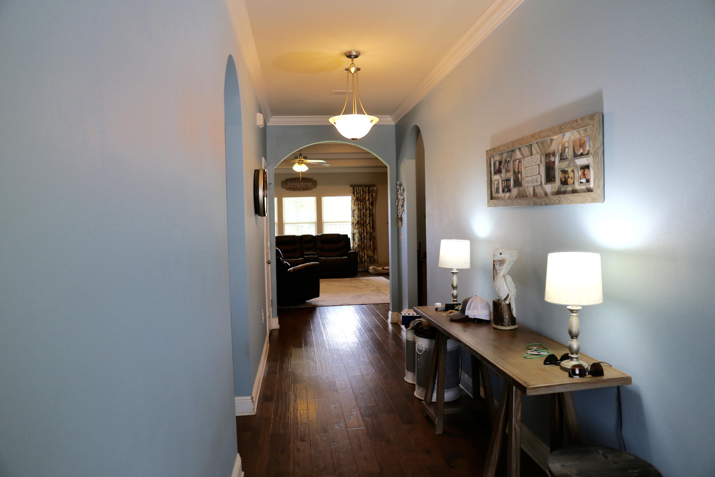 400 Lilly Bell Lane, Unit LOT 26 Freeport, FL 32439 - Photo 5 of 43 a view of a room with wooden floor table and chairs