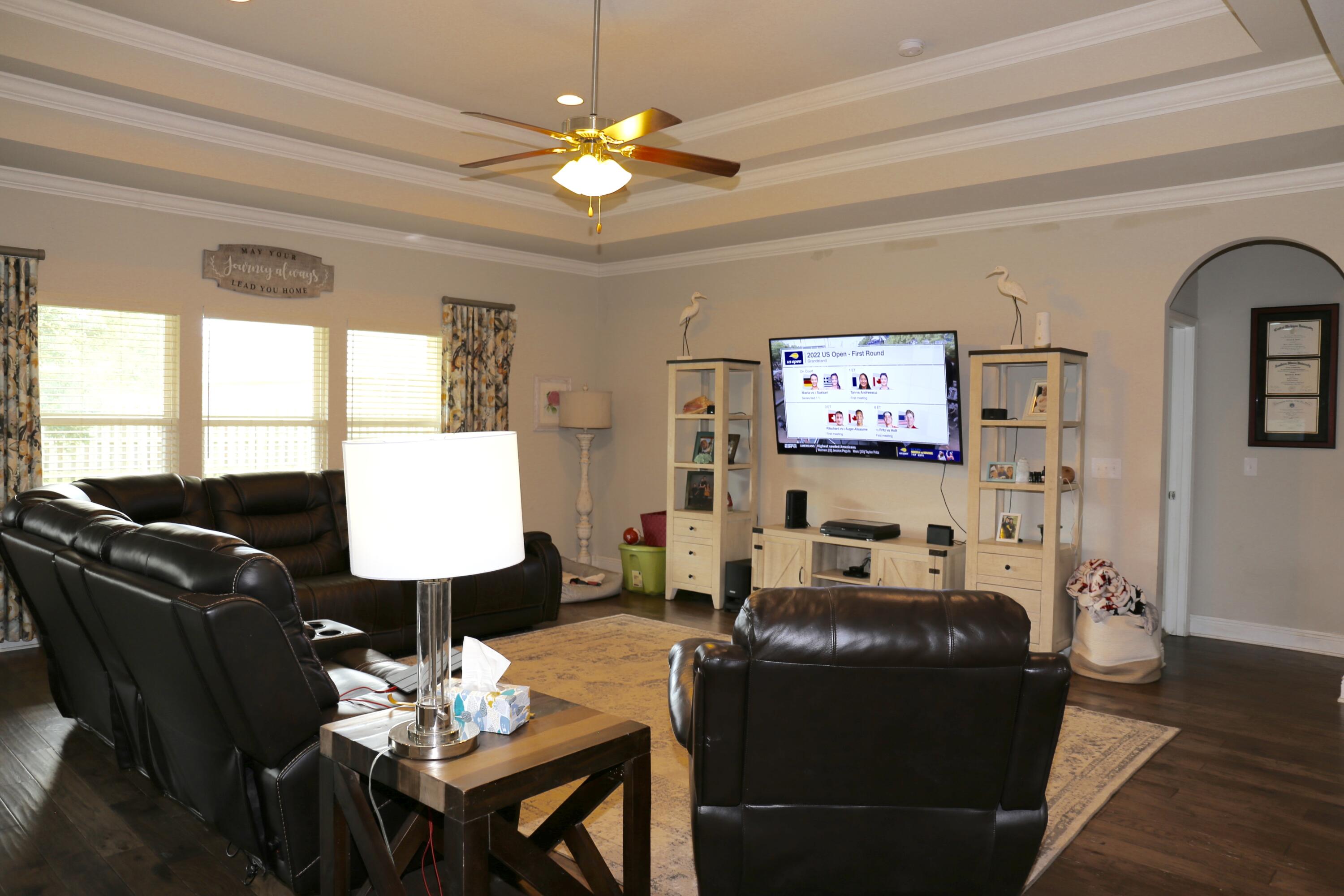 400 Lilly Bell Lane, Unit LOT 26 Freeport, FL 32439 - Photo 10 of 43 a living room with furniture chandelier and a window