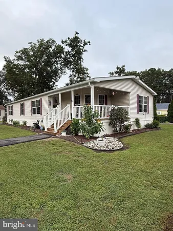 a view of a house with swimming pool yard and outdoor seating