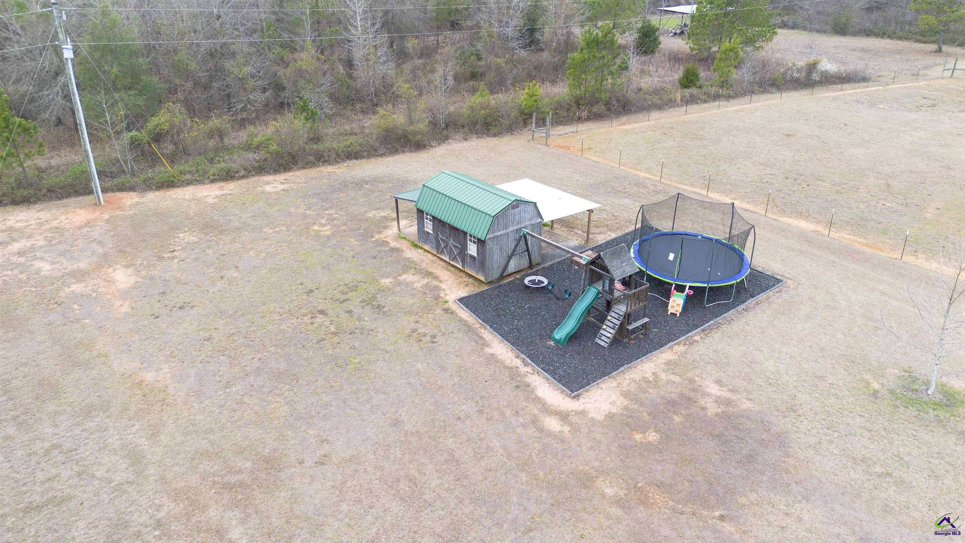 500 Old Milledgeville Road Cochran, GA 31014 - Photo 22 of 48 an aerial view of a house with a yard