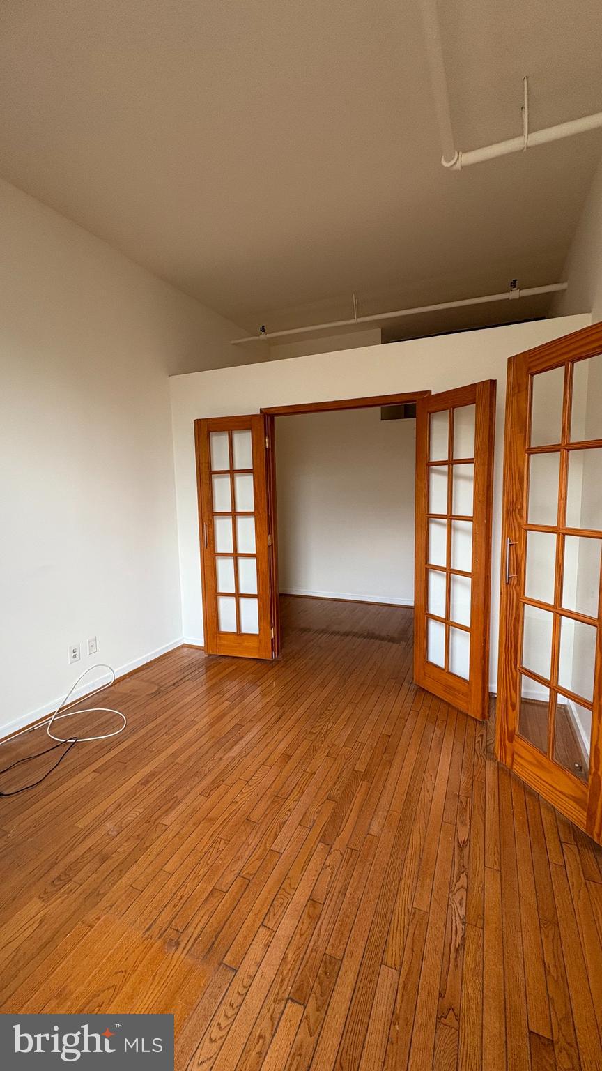 1010 Race Street, Unit 5I Philadelphia, PA 19107 - Photo 6 of 11 wooden floor in an empty room