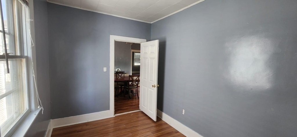 153 Jencks Street Fall River, MA 02723 - Photo 12 of 19 an empty room with wooden floor and entrance