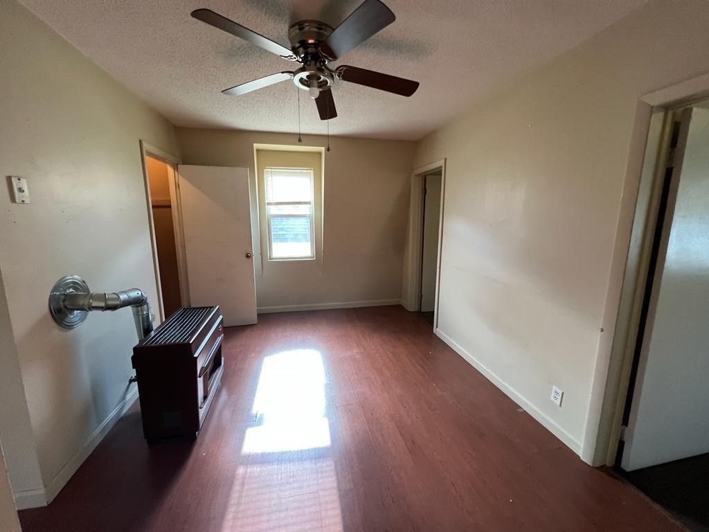 153 Jencks Street Fall River, MA 02723 - Photo 4 of 19 wooden floor in an empty room with a window