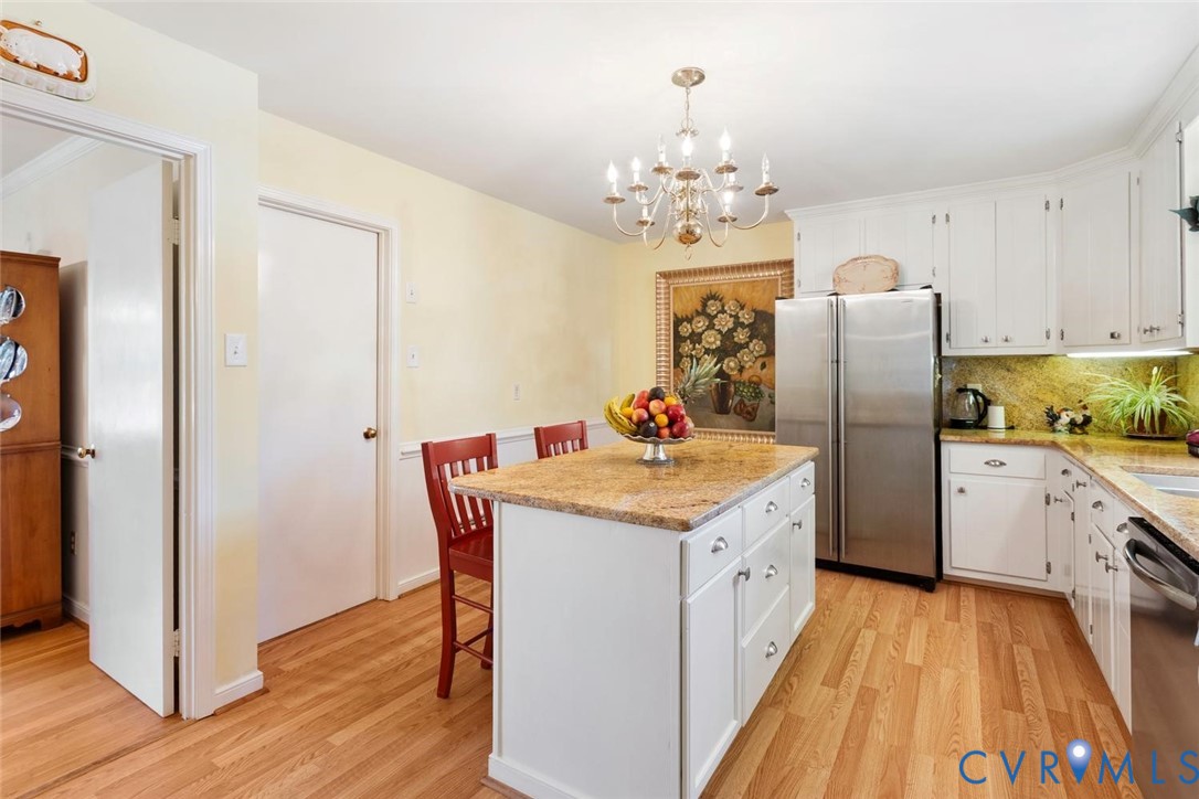 10260 Maplested Lane Henrico, VA 23229 - Photo 17 of 38 Kitchen featuring a central island with a stone-fi