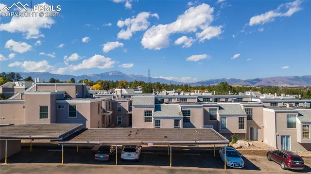 a view of a patio with swimming pool table and chairs