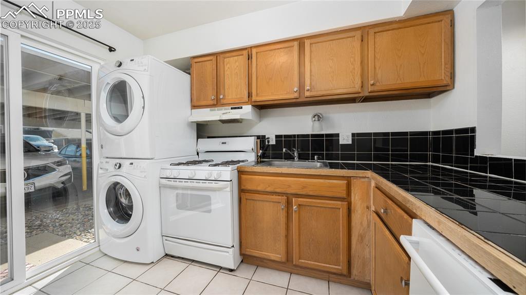 3150 Van Teylingen Drive, Unit A Colorado Springs, CO 80917 - Photo 6 of 14 a view of a kitchen with washer and dryer