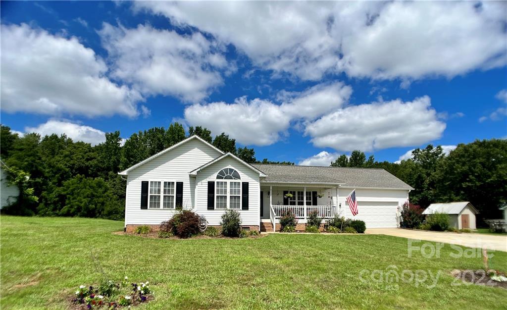 2325 Sides Road Rockwell, NC 28138 - Photo 1 of 14 a front view of a house with a garden