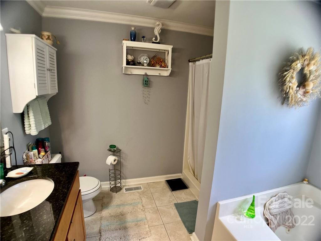 2325 Sides Road Rockwell, NC 28138 - Photo 11 of 14 a bathroom with a sink toilet and mirror