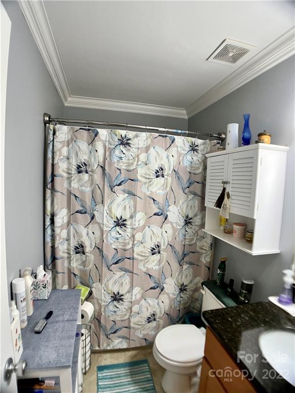 2325 Sides Road Rockwell, NC 28138 - Photo 14 of 14 a bathroom with a granite countertop toilet and a sink