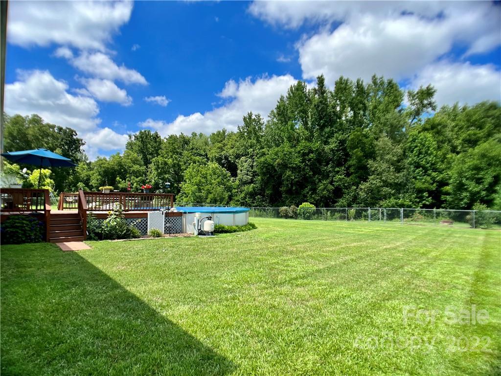 2325 Sides Road Rockwell, NC 28138 - Photo 4 of 14 a view of yard with swimming pool and green space