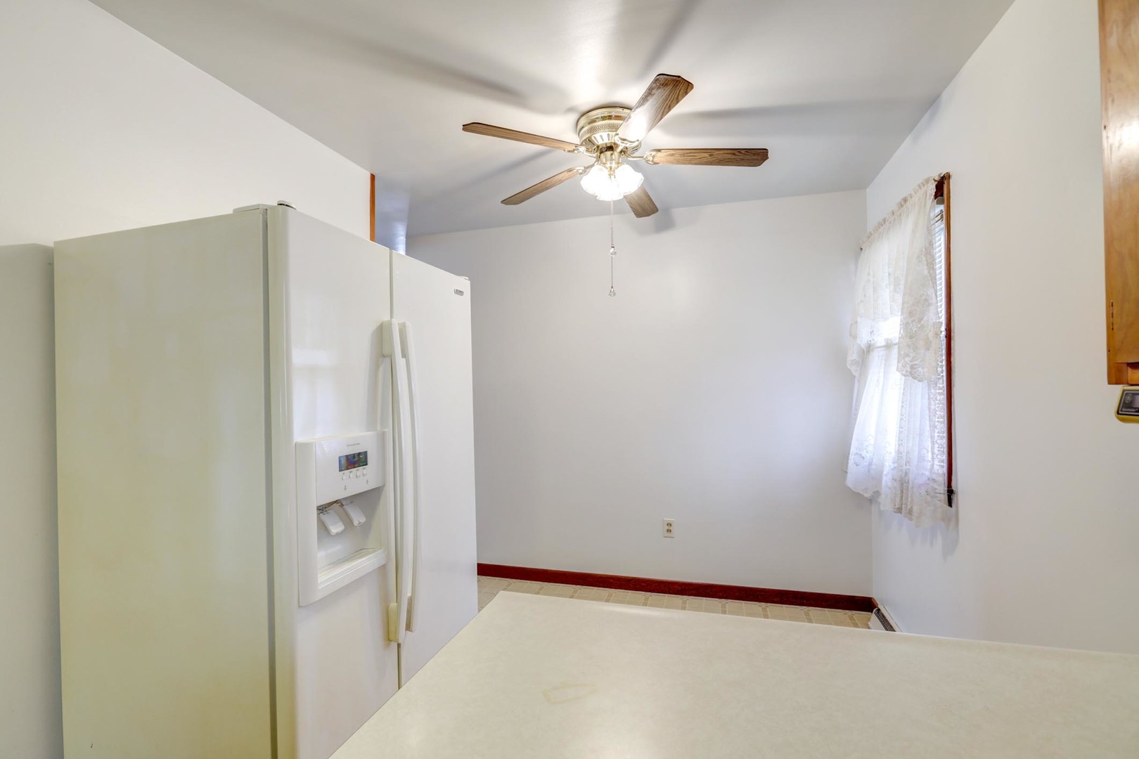 135 Ottawa Road Paxton, IL 60957 - Photo 8 of 21 a view of an empty room with a window