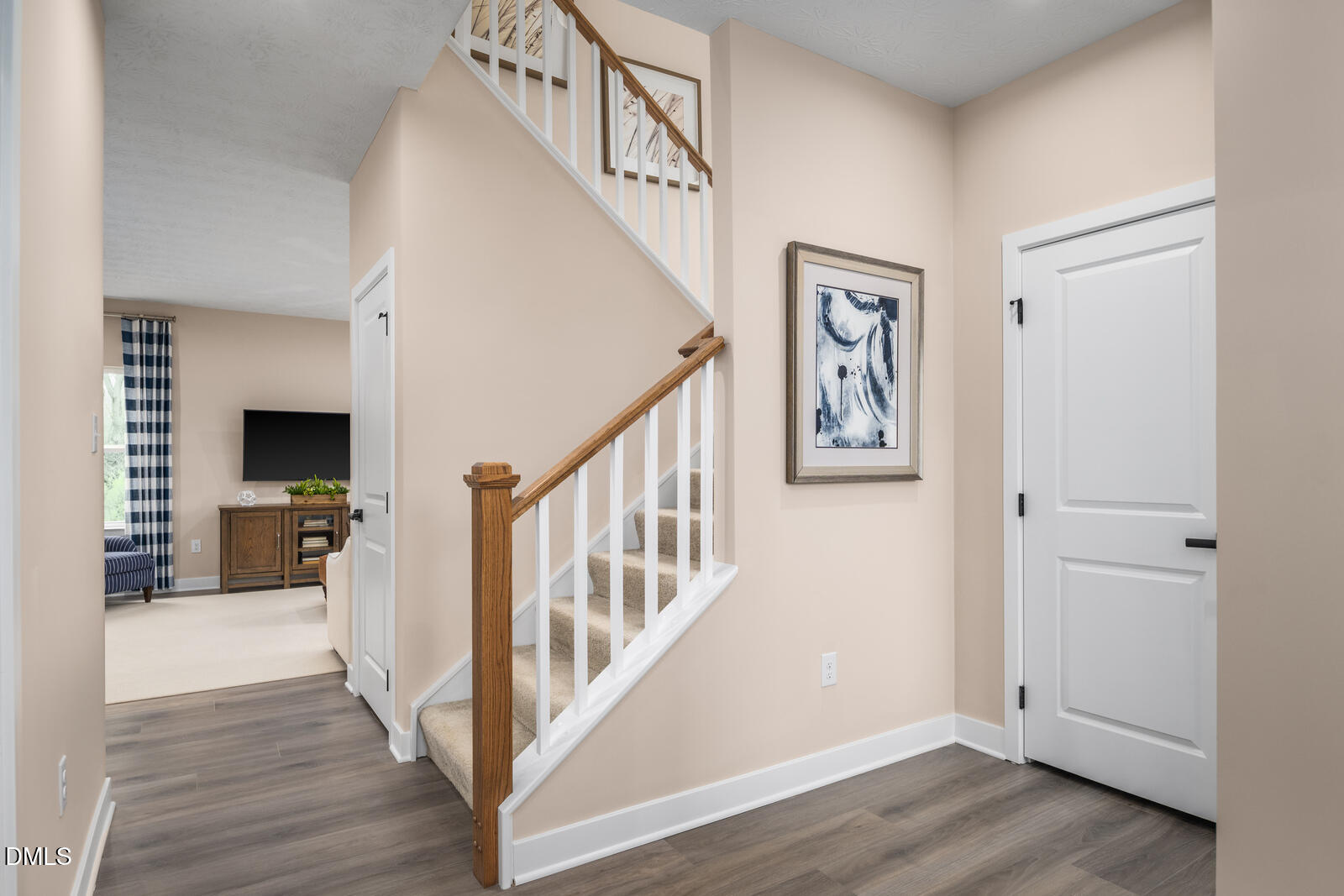 913 Walker Rdg Way Willow Spring, NC 27592 - Photo 12 of 23 a view of a hallway with wooden floor and staircase
