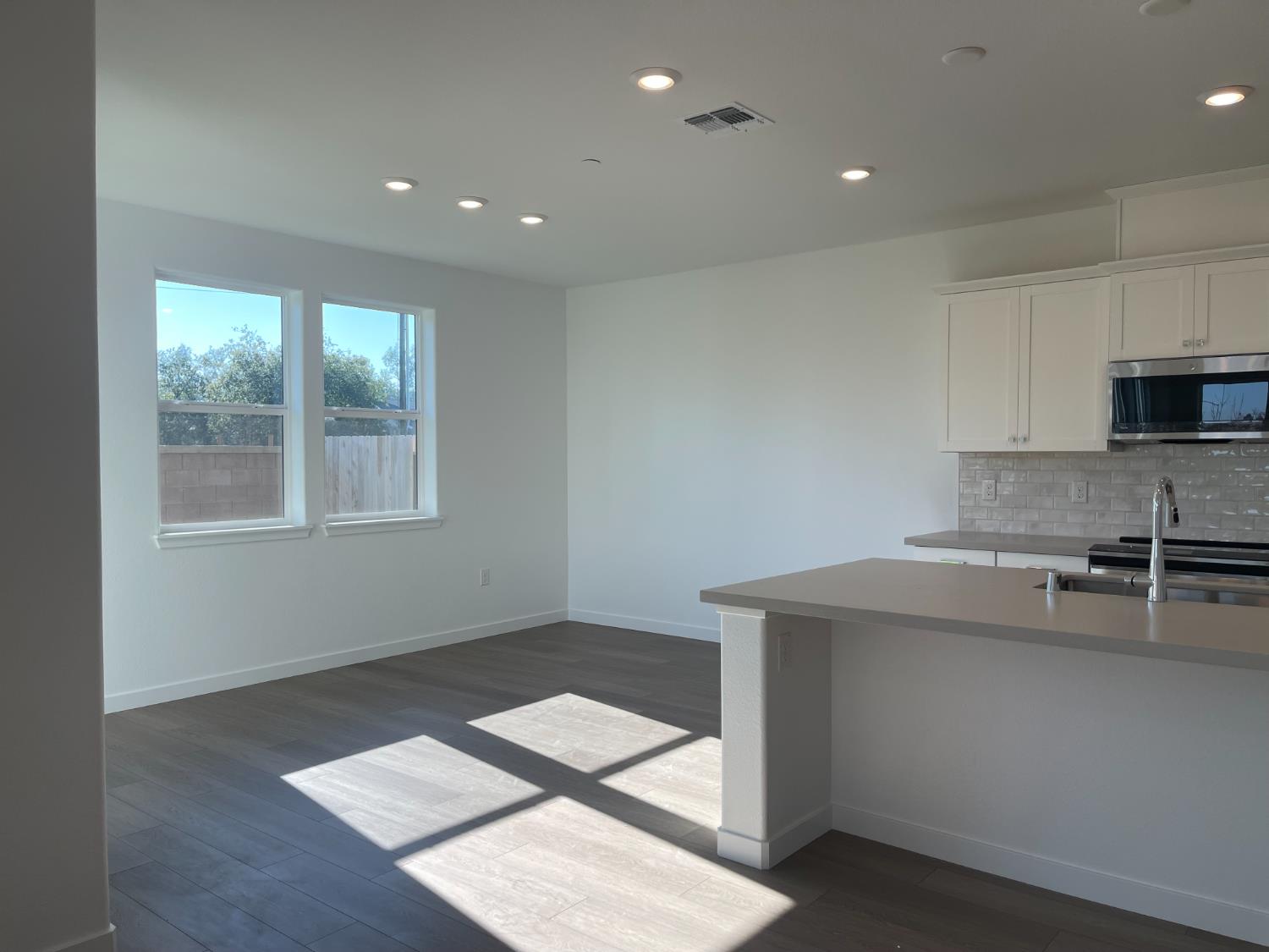 8512 Cottonseed Way Elk Grove, CA 95624 - Photo 4 of 9 a kitchen with a sink cabinets and window