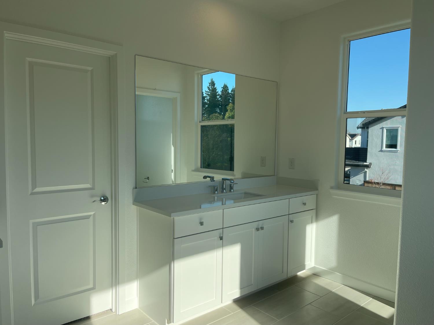 8512 Cottonseed Way Elk Grove, CA 95624 - Photo 9 of 9 a bathroom with a sink and a mirror