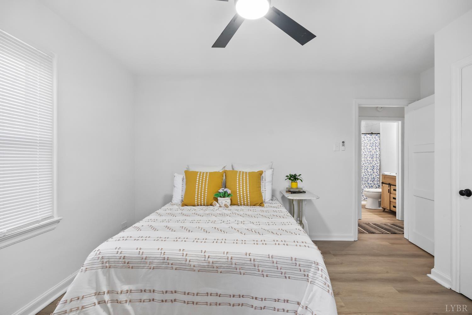 1201 Brandon Road Lynchburg, VA 24502 - Photo 12 of 25 a bedroom with a bed and wooden floor