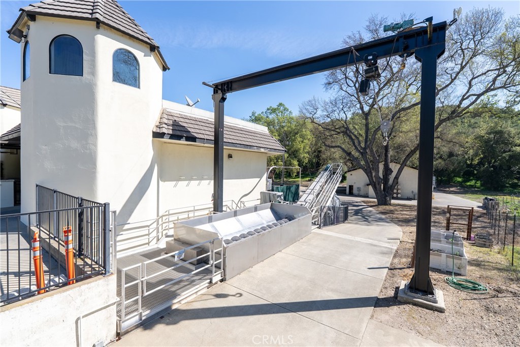 2720 Oak View Road Templeton, CA 93465 - Photo 25 of 64 a view of two chairs and a large tree in front of house