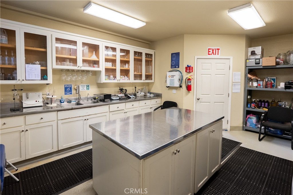 2720 Oak View Road Templeton, CA 93465 - Photo 32 of 64 a kitchen with a sink stove and cabinets