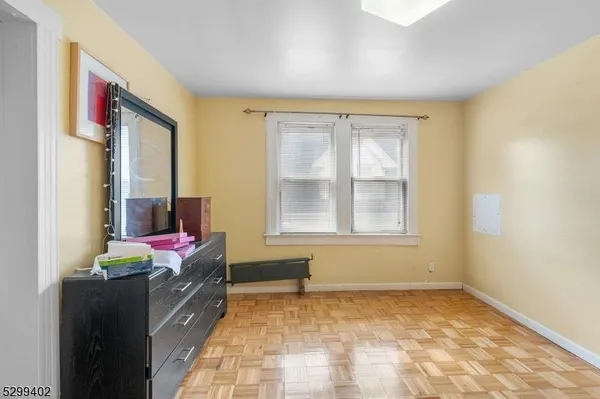a bed room with a bed and a television