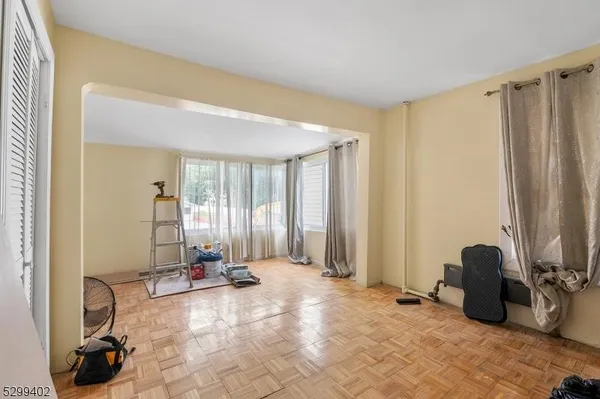 a view of a room with gym equipment and a window