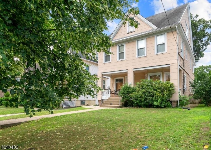 27 Donaldson Avenue Rutherford, NJ 07070 - Photo 2 of 19 a front view of house with yard and green space