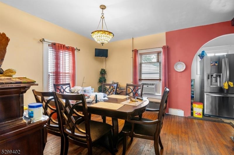 27 Donaldson Avenue Rutherford, NJ 07070 - Photo 7 of 19 a view of a dining room with furniture window and wooden floor