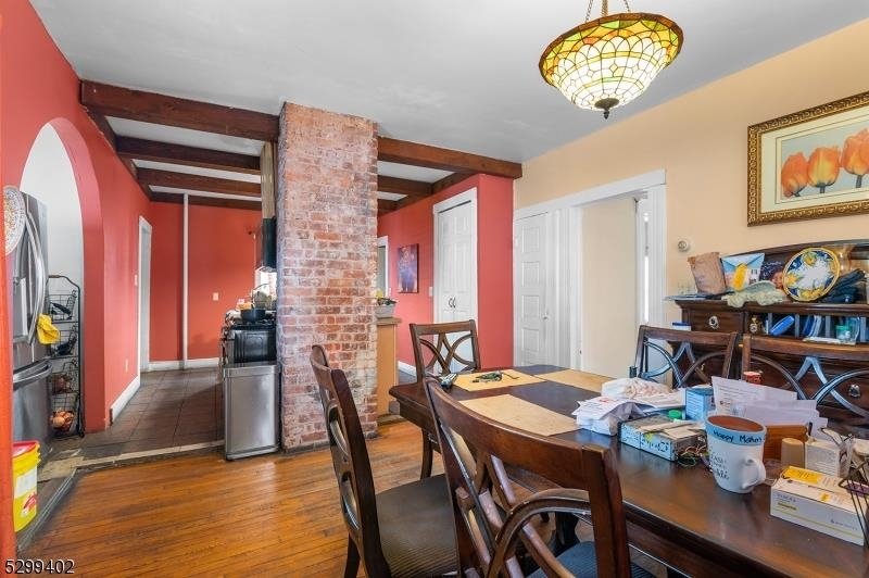 27 Donaldson Avenue Rutherford, NJ 07070 - Photo 8 of 19 a view of a dining room with furniture and a chandelier