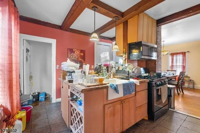 a kitchen with stainless steel appliances granite countertop a sink and cabinets