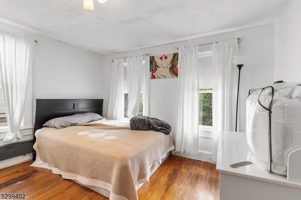 a bedroom with a bed and a mirror