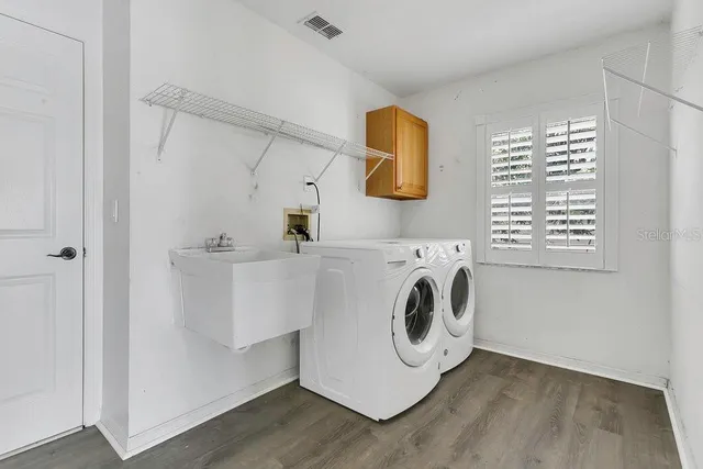 a utility room with dryer and washer
