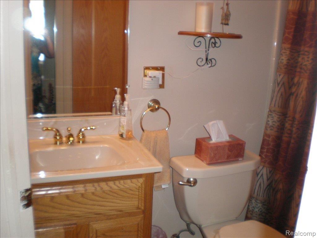 13466 Trenton Road Southgate, MI 48195 - Photo 10 of 14 oak vanity