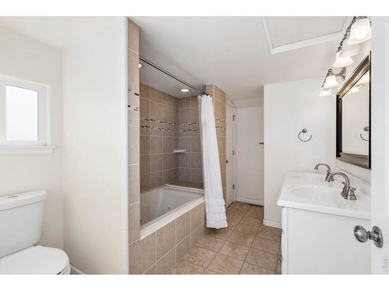 1083 2nd Street Nunn, CO 80648 - Photo 17 of 50 a bathroom with a sink a toilet and shower