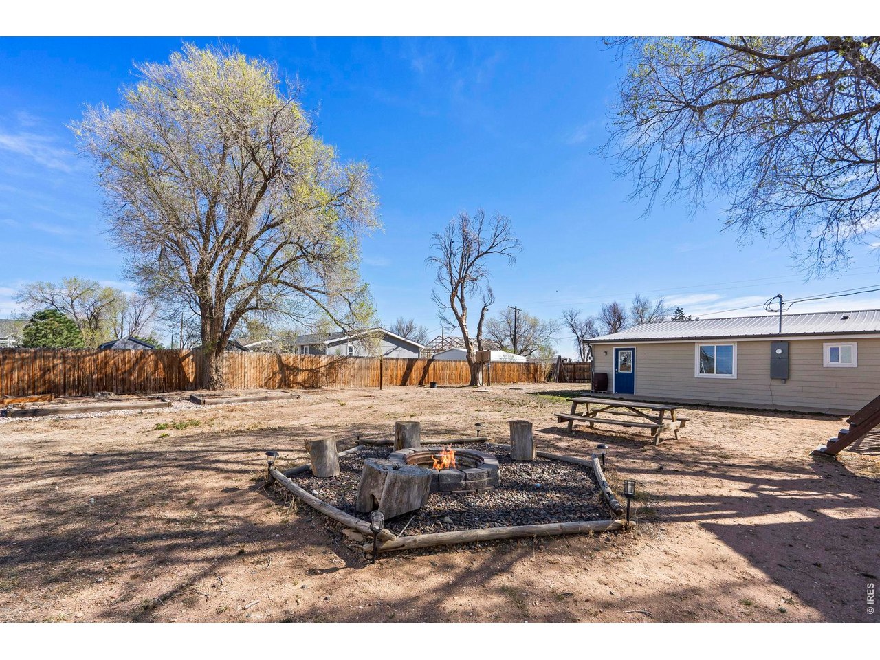 1083 2nd Street Nunn, CO 80648 - Photo 30 of 50 a view of a backyard with wooden fence