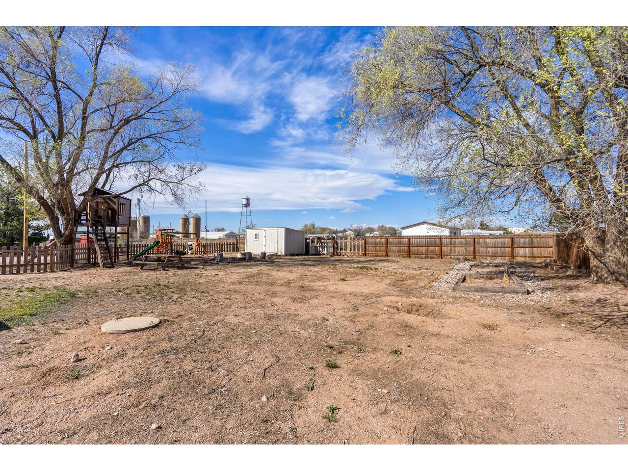 1083 2nd Street Nunn, CO 80648 - Photo 40 of 50 a view of a dry yard with trees